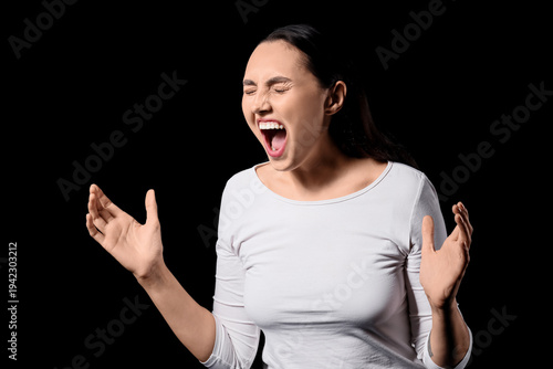 Screaming young woman on da...