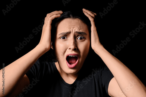 Screaming young woman on bl...