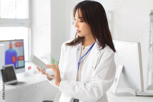 Female Asian scientist work...