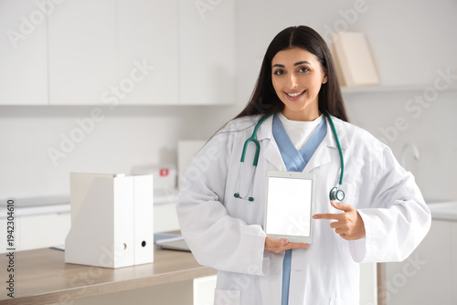 Female doctor with blank ta...