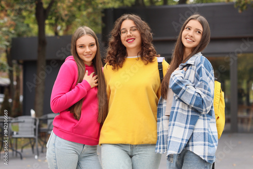Happy teenage girls in park