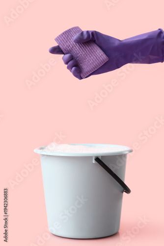 Female hand in rubber glove...