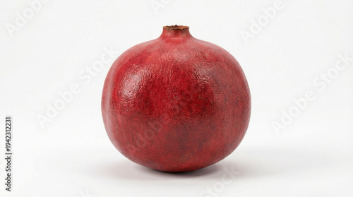 A vibrant red pomegranate sits alone on a clean white background