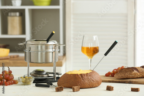 Cheese fondue in bread, gra...