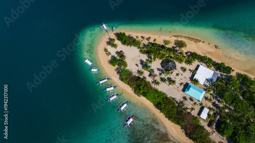Aeria top donwnl drone shot of the tropical Cowrie Island in Honda Bay, Puerto Princesa, Palawan, Philippines