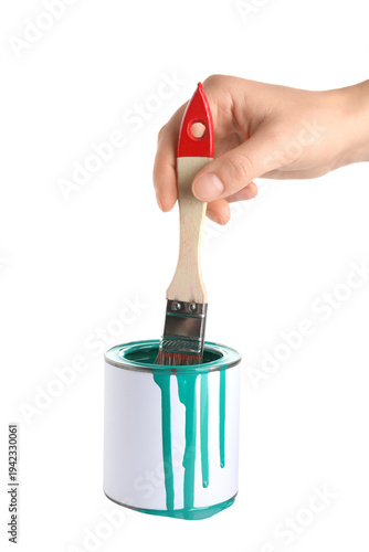 Female hand with can of tur...