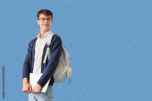 Male student with laptop on...