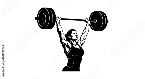 Woman lifting heavy barbell overhead with determination and strength