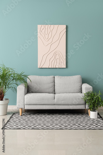 Comfortable grey sofa and h...