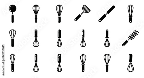 Collection of various kitchen utensils and whisks displayed against a clean background from a straightforward viewpoint