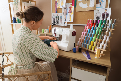 Young female tailor working...