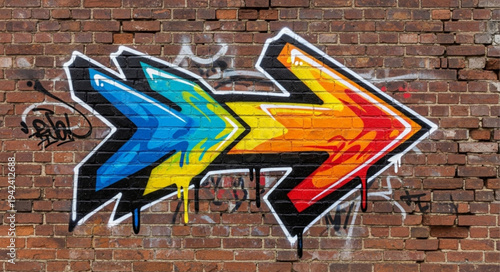 Colorful Arrow Graffiti Art on Brick Wall.