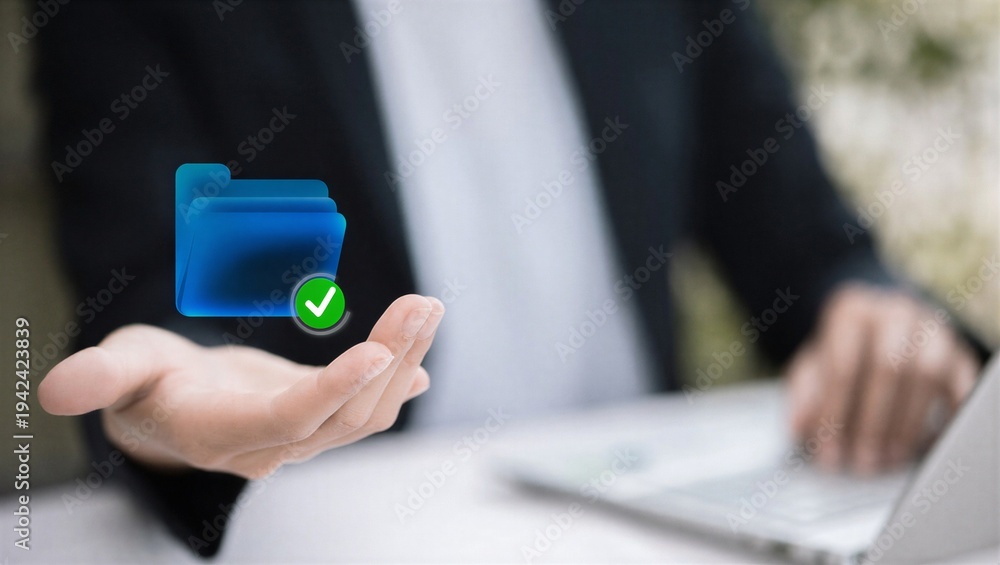 Fototapeta premium Person holding a blue folder with a checkmark symbol on it.