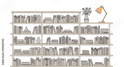 Large bookshelf filled with many books in various sizes and colors alongside a vase of flowers and an orange lamp.