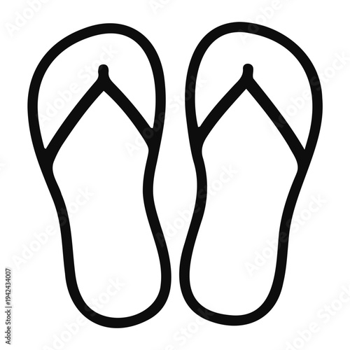 Tropical vacation mode with flip flops on sandy beach at sunset