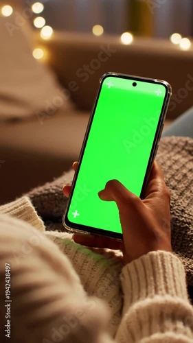 Wallpaper Mural Green Screen vertical feminine hand scrolling feed on smartphone with mock up display female resting at home and checking social media mobile device close over the shoulder footage scene 3 distortion Torontodigital.ca