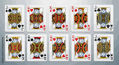 Collection of face playing cards arranged on a grey background