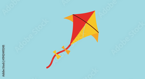 Colorful red and yellow kite flying in clear blue sky