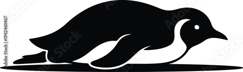 Silhouette of a penguin sliding on its belly vector design