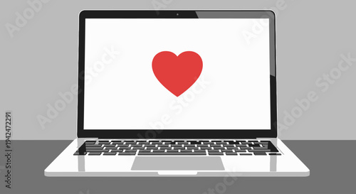 Laptop computer with red heart graphic on screen