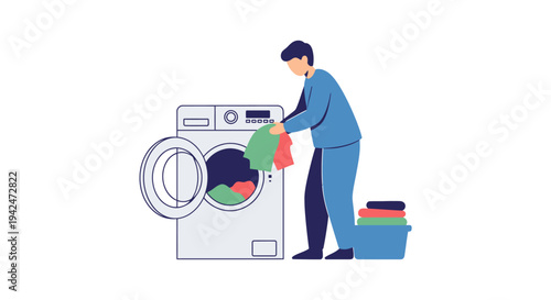 Man loading clothes into washing machine doing laundry at home