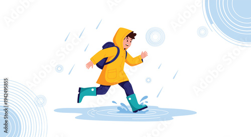 Happy young boy wearing a bright yellow raincoat and boots while running through puddles during a rainy day.