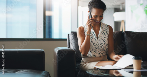 Photos Phone call, business and woman with document on sofa in office for financial deal, offer or listen