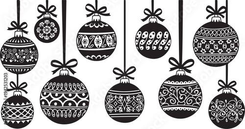 Black and white Christmas ornaments hanging in a row