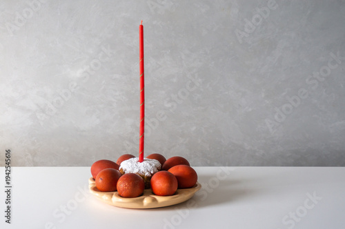 Happy Easter. Easter greeting background. Easter eggs and red candle. Background with space for text.
