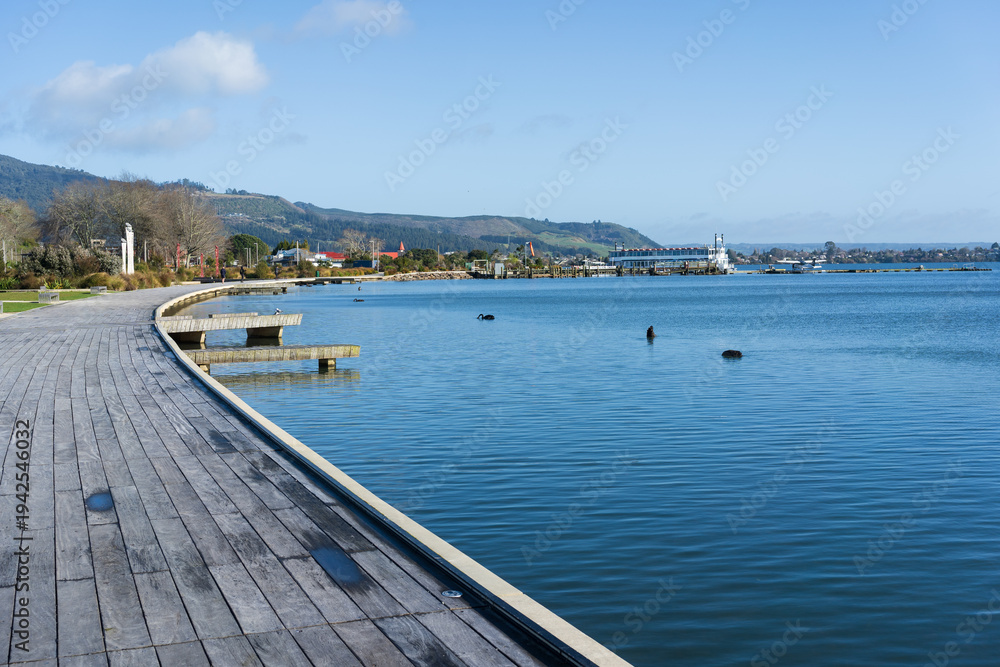 Fototapeta premium Wooden lakefront boardwalk along Lake Rotorua