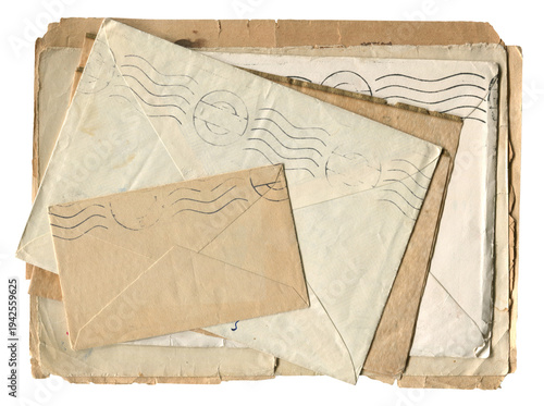 Stack of vintage paper envelopes and old letters with postal marks on white