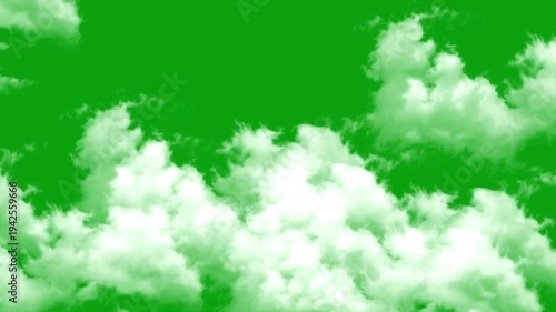 Bottom view of dramatic white clouds moving across a bright green screen, ideal for visual effects and sky replacement.