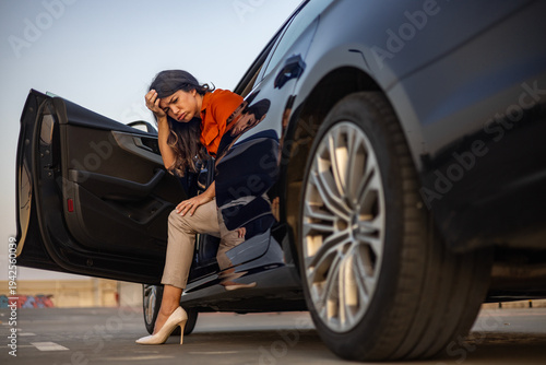 фотографія Woman feeling sick leaving car