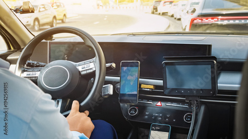 Photos Taxi working at a busy intersection with a screen showing directions in the vehi