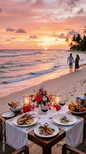 Romantic Beach Dinner Setup with Sunset Over the Ocean and Couples Walking Along the Shoreline