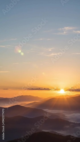 Serene Aerial View of Layers of Mountains at Sunset with Slow Dolly Motion Effect Captured Over Horizon