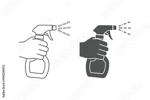 Two hands holding spray bottles with liquid spraying out, one in black and white and the other in gray, symbolizing cleaning or disinfecting actions.