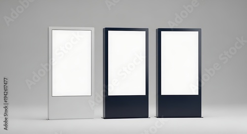 Three modern digital advertising displays with blank screens for promotional content.