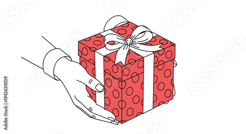 Person hands carefully holding a red gift box with white polka dots and a white bow ready to give a special present to someone.