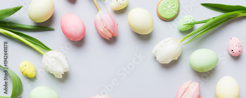 Wallpaper Mural Happy Easter composition. Easter eggs on colored table with yellow Tulips. Natural dyed colorful eggs background top view with copy space Torontodigital.ca