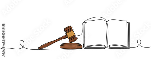 Gavel and open book resting beside each other on white background