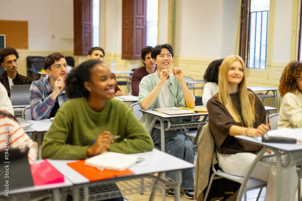 Fototapeta premium Diverse students learning in a high school classroom