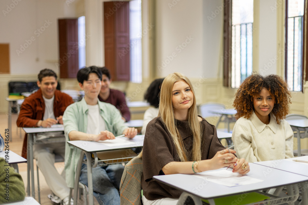 Obraz premium Diverse students learning together in a bright classroom