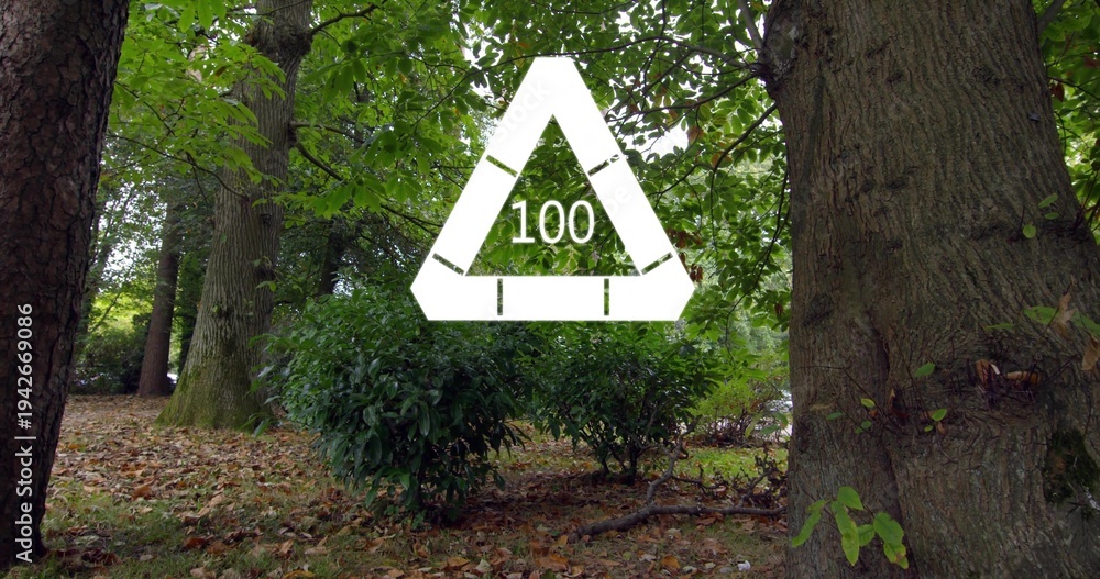 Naklejka premium Floating white triangular overlay showing 100 over park floor under leafy canopy, with tree trunks