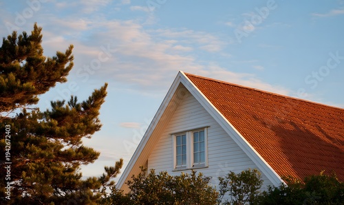 a suburban european house with a triangular roof