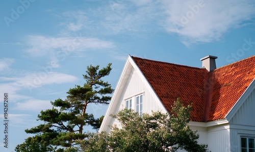 a suburban european house with a triangular roof