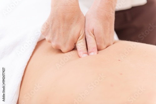 Εκτύπωση καμβά Close-up of hands performing a massage on a person's back