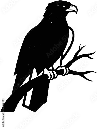 A black silhouette of a bird of prey perched on a branch