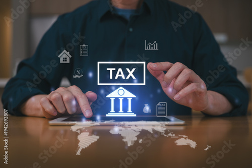 Businessman using a digital tablet to complete Individual income tax return form online for tax payment. Government, state taxes. Data analysis, paperwork, financial research, report