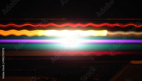 Abstract horizontal streaks of light in vibrant colors on a black background
